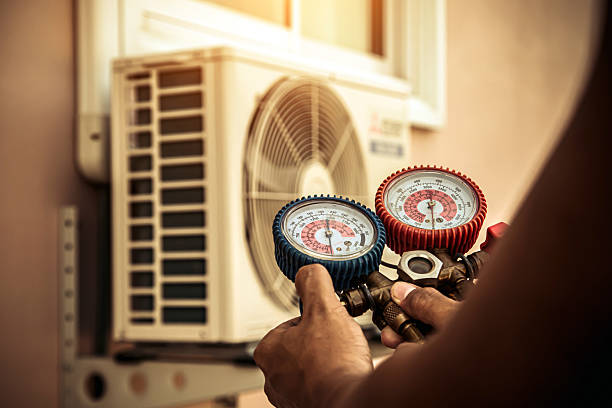 Professional Air Conditioning Service technician working in Wheaton, MN